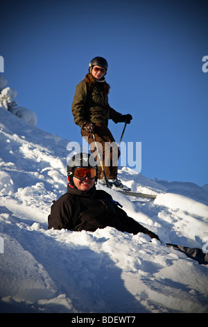 Skier and snowboarder in deep snow Stock Photo