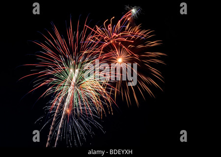 Beautiful fireworks fill the night time sky Stock Photo