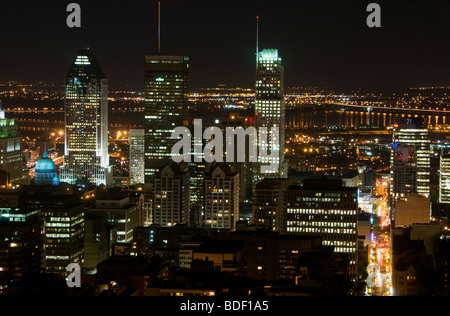 A view across downtown Montreal in Canada at night as seen from the top of Mont Royal Stock Photo