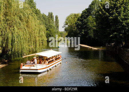 A tourist boat on the rive Dronne at Brantome in the Dordogne , France Stock Photo