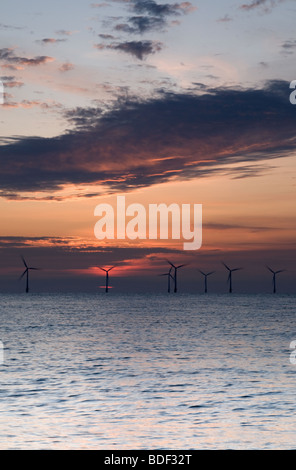 Off shore windfarm at sunrise on Norfolk Coast at Caister on Sea Stock Photo