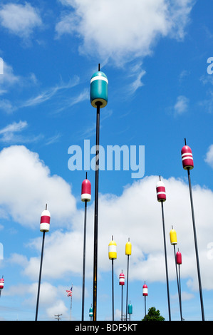 Lobster fishing buoys on poles as outdoor art installation on Hyannis Harbor, Cape Cod Stock Photo