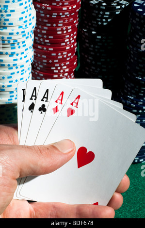 Poker hand with stack of winning chips Stock Photo