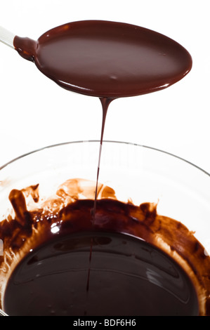 bowl of melted chocolate and spoon Stock Photo