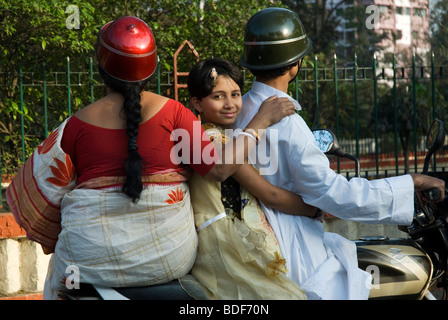 Family in a motorcycle, near the National Library. Kolkata (Calcuta), India. Stock Photo