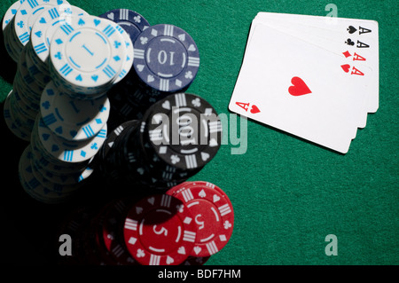 Poker hand with stack of winning chips Stock Photo