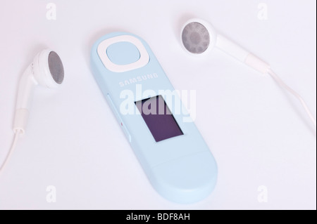 A close up of a Samsung U5 MP3 player with headphones on a white background Stock Photo