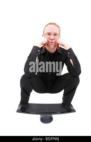 young man on board balancing on roll Stock Photo