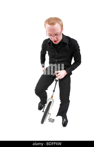 young man riding unicycle Stock Photo