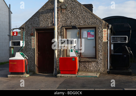 petrol and diesel fuel pumps outside traditional small garage in an irish village county down northern ireland uk Stock Photo