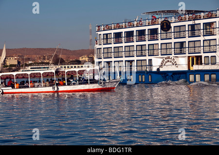 Aswan small colorful passenger ferry boat Nile River Aswan Egypt traditional transport vessel nile cruise ship Stock Photo