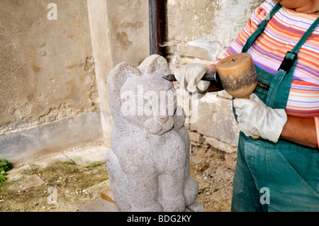 Sculptor working on a stone Stock Photo