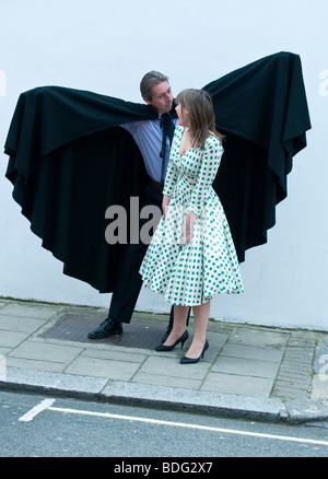 A dramatic black cape  worn by Christopher Lee in the classic Dracula of 1958 and a frock from Dr Who worn by Bonham's employees Stock Photo