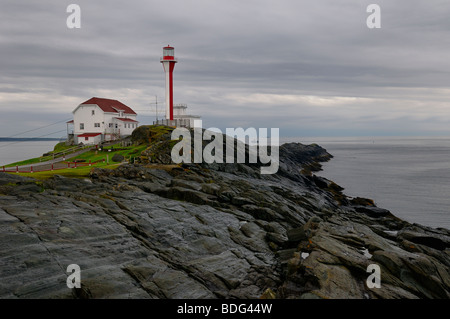 Cape Forchu lighthouse on the Atlantic Ocean the morning after a rain storm near Yarmouth Nova Scotia Stock Photo