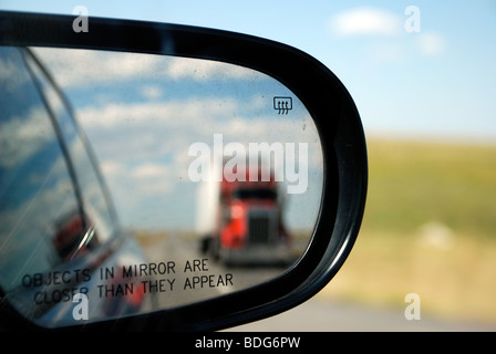 Truck in rear view mirror Stock Photo