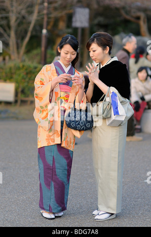 Young people wearing the traditional dress, kimono, in Maruyama Park, Kyoto, Japan, Asia Stock Photo