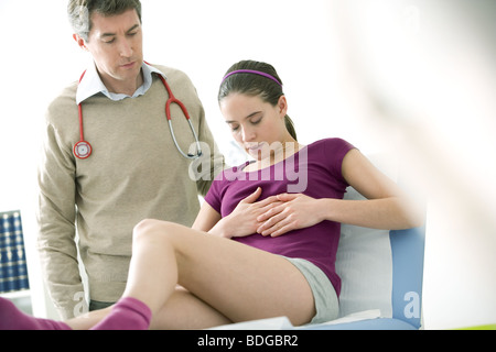 CONSULTATION, WOMAN IN PAIN Stock Photo