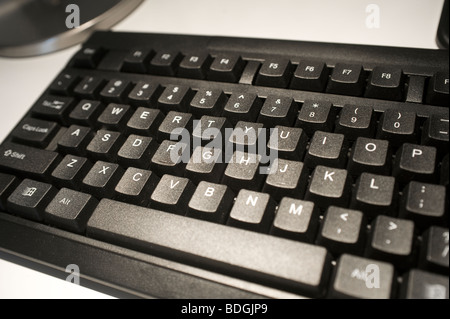 Close up of a black computer keyboard on a desk Stock Photo