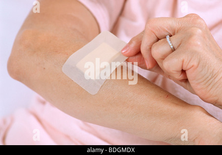 ELDERLY PERSON DRESSING Stock Photo