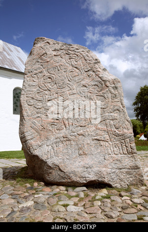 Jelling, Denmark. The figure of Christ on the large Jelling rune stone raised by King Harald Bluetooth in the 960s. Other side of runic text. Stock Photo