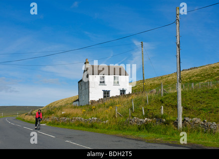 Cyclist in Upper Teesdale, County Durham, England UK Stock Photo