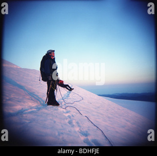 A pinhole camera shot of a young man on a glacier in Washington. Stock Photo