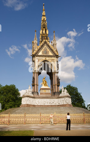 Tourist posing in front of the Prince Albert Memorial in Hyde Park. Stock Photo