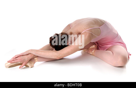 Ballet dancer laying on floor over a white background Stock Photo