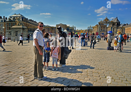 Paris, France - Tourist Family with Children, Visiting 'French Monument', 'Chateau de Versailles', Buying Paris Souvenirs, front of French chateau,, Stock Photo