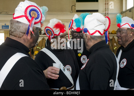 The Britannia cocoa-nut dancers pause for a break in the fire station in Bacup Stock Photo