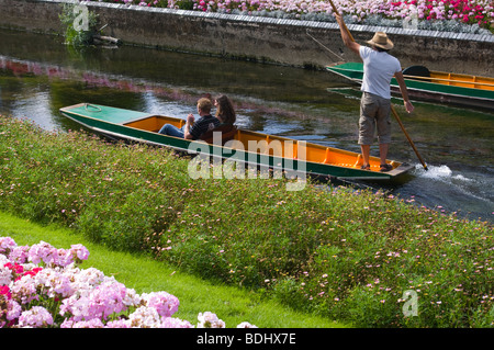 A Punter With His Punt With Two people On The River Stour Canterbury Kent England UK Stock Photo