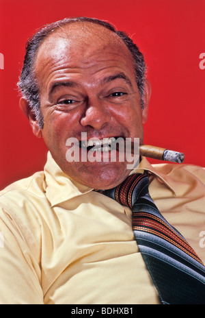 Smiling  business man cigar gestures in teamwork meeting conference Stock Photo
