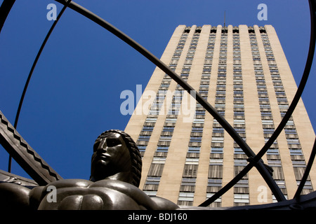 Rockefeller Center and the bronze Statue of Atlas holding up the world as a wireframe globe. Stock Photo