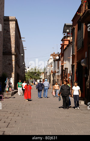 People strolling along the Callejon de San Francisco alley in the city of San Luis Potosi, Mexico Stock Photo