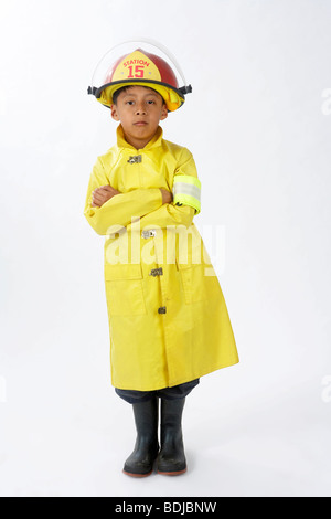 Boy Dressed as Firefighter Stock Photo