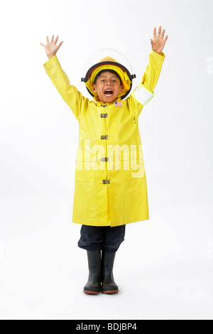 Boy Dressed as Firefighter Stock Photo