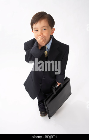 Little Boy Dressed Up as a Businessman Stock Photo