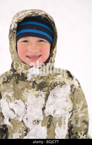 Little Boy Playing in the Snow Stock Photo