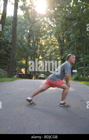Man Stretching Before Morning Run Stock Photo