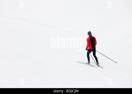 Backview of Woman Cross Country Skiing, Whistler, British Columbia, Canada Stock Photo