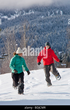 Couple Snowshoeing, Whistler, British Columbian, Canada Stock Photo
