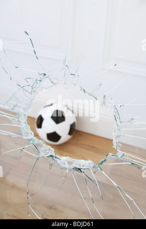 Soccer Ball and Broken Window Stock Photo