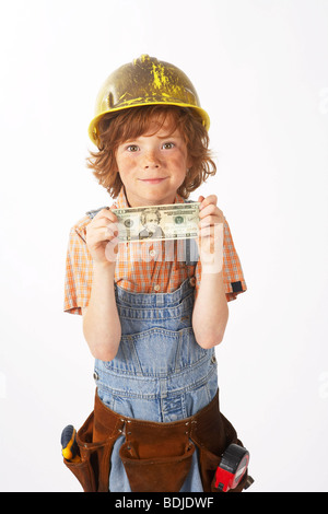 Boy Dressed Up as Construction Worker Holding Money Stock Photo