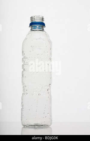 empty plastic water bottle on white background Stock Photo - Alamy