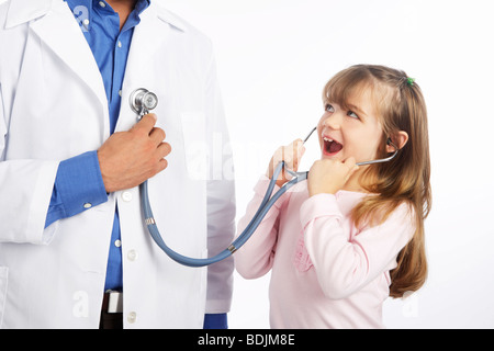 Girl Playing with Stethoscope Stock Photo