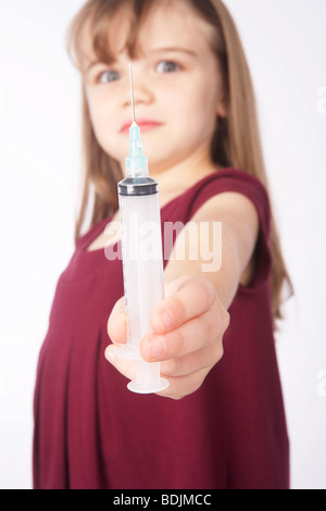 Girl Holding a Needle Stock Photo