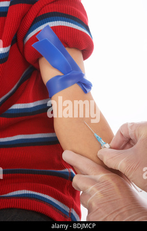 Close-up of Boy Getting a Needle Stock Photo