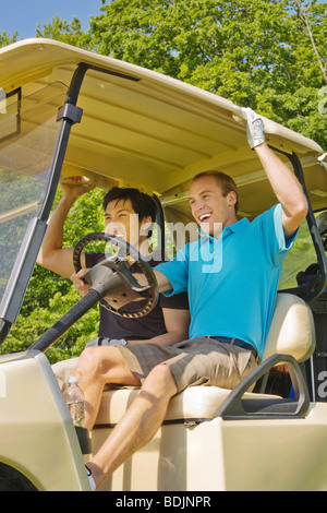 Men in Golf Cart Stock Photo