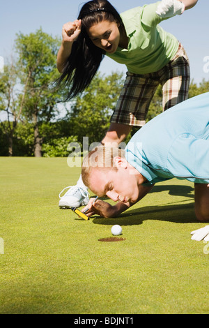 Couple at Golf Club Stock Photo