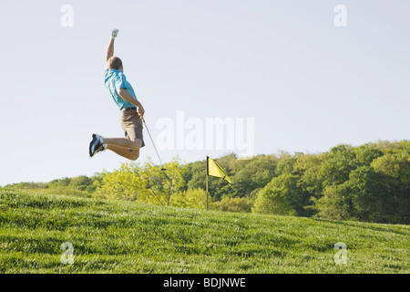 Excited Golfer Jumping Stock Photo